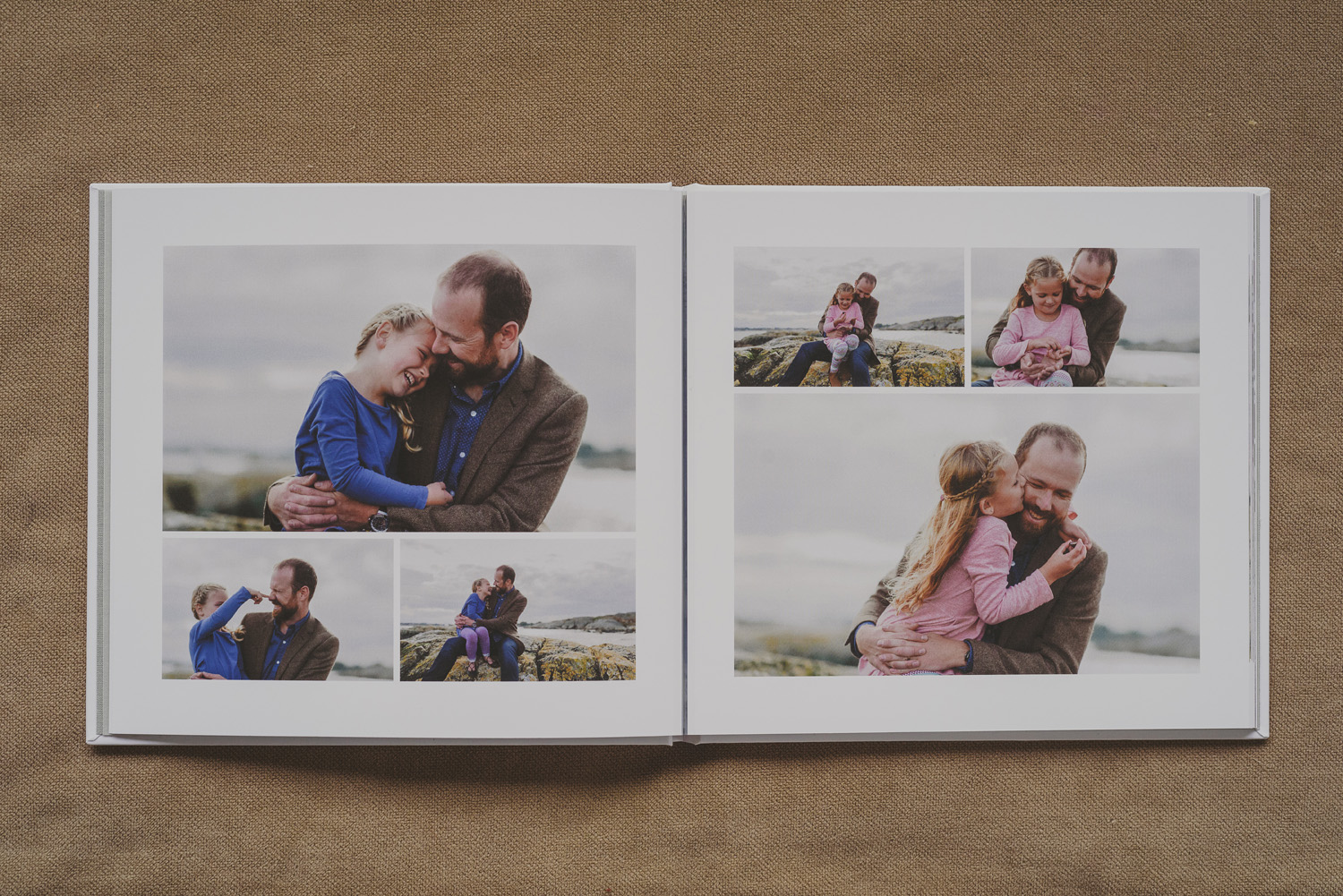 beautiful family photo book-dad snuggling young daughter at beach
