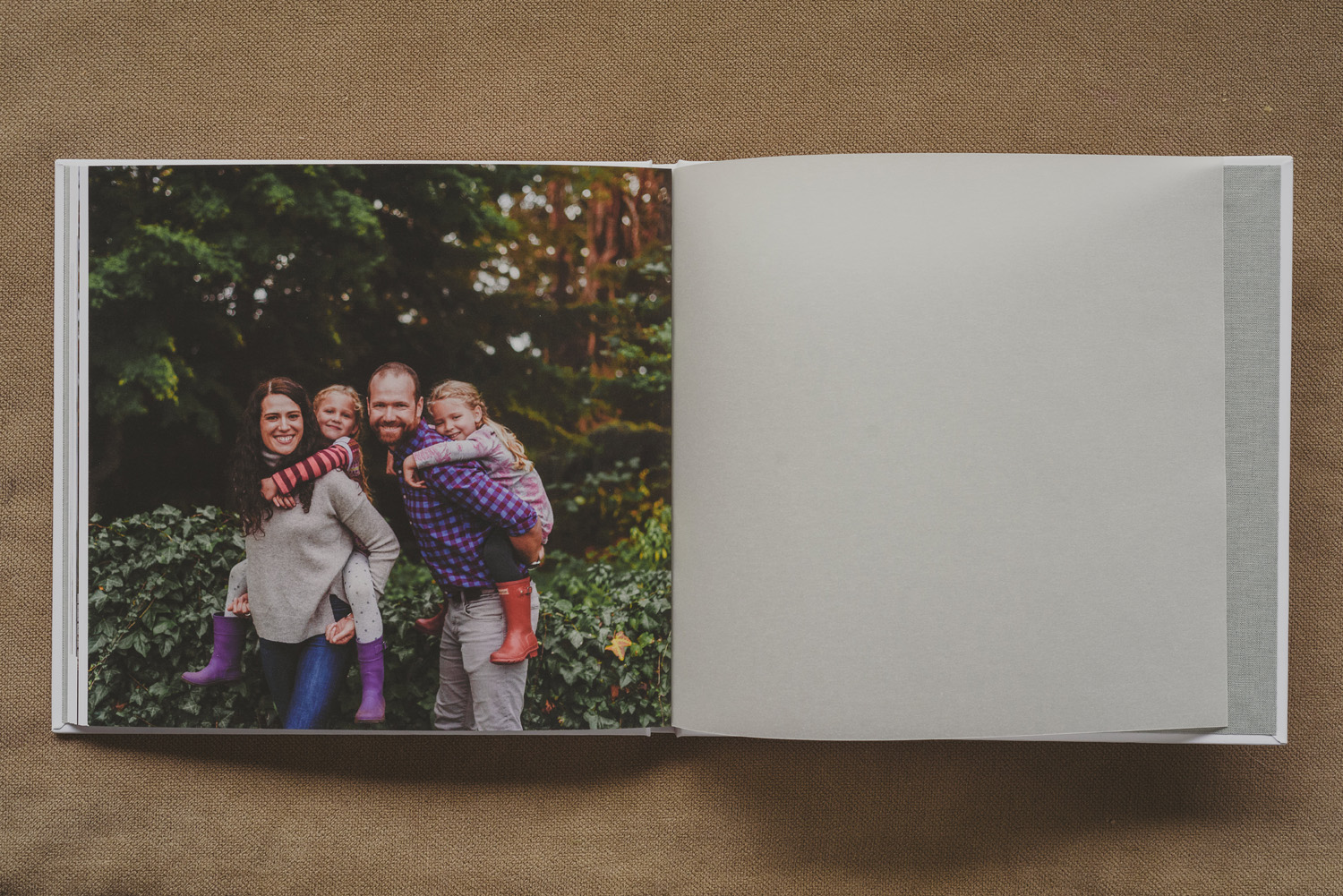 beautiful family photo book-family photo with kids on parents backs