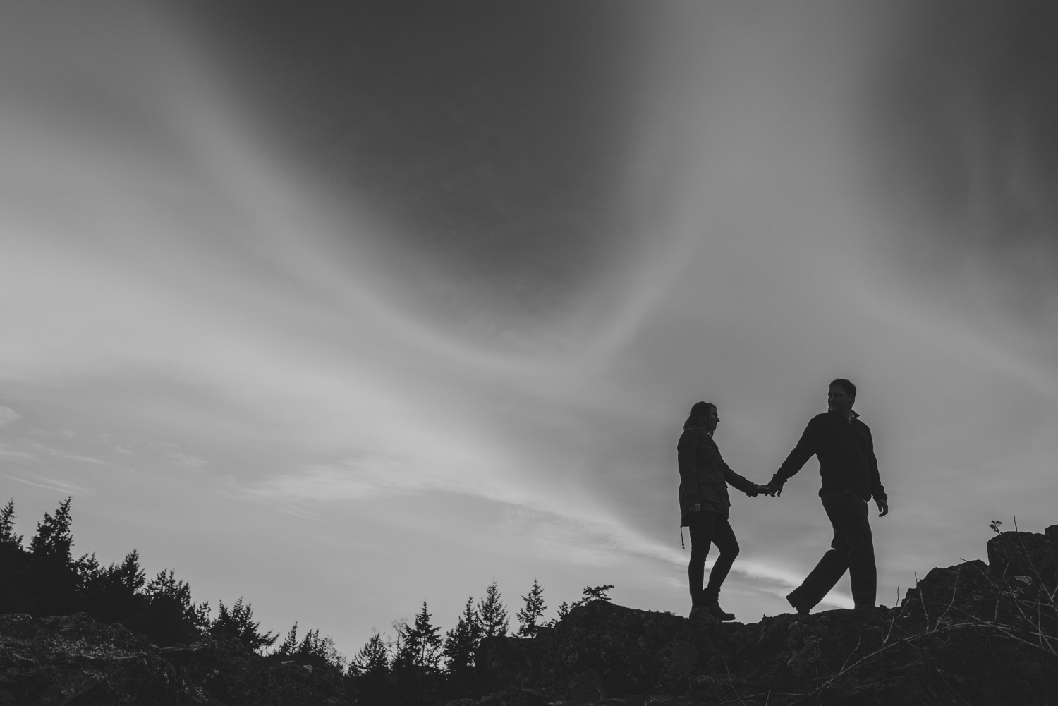 vancouver-island-bc-engagement-couple silhouetted by a dramatic sky