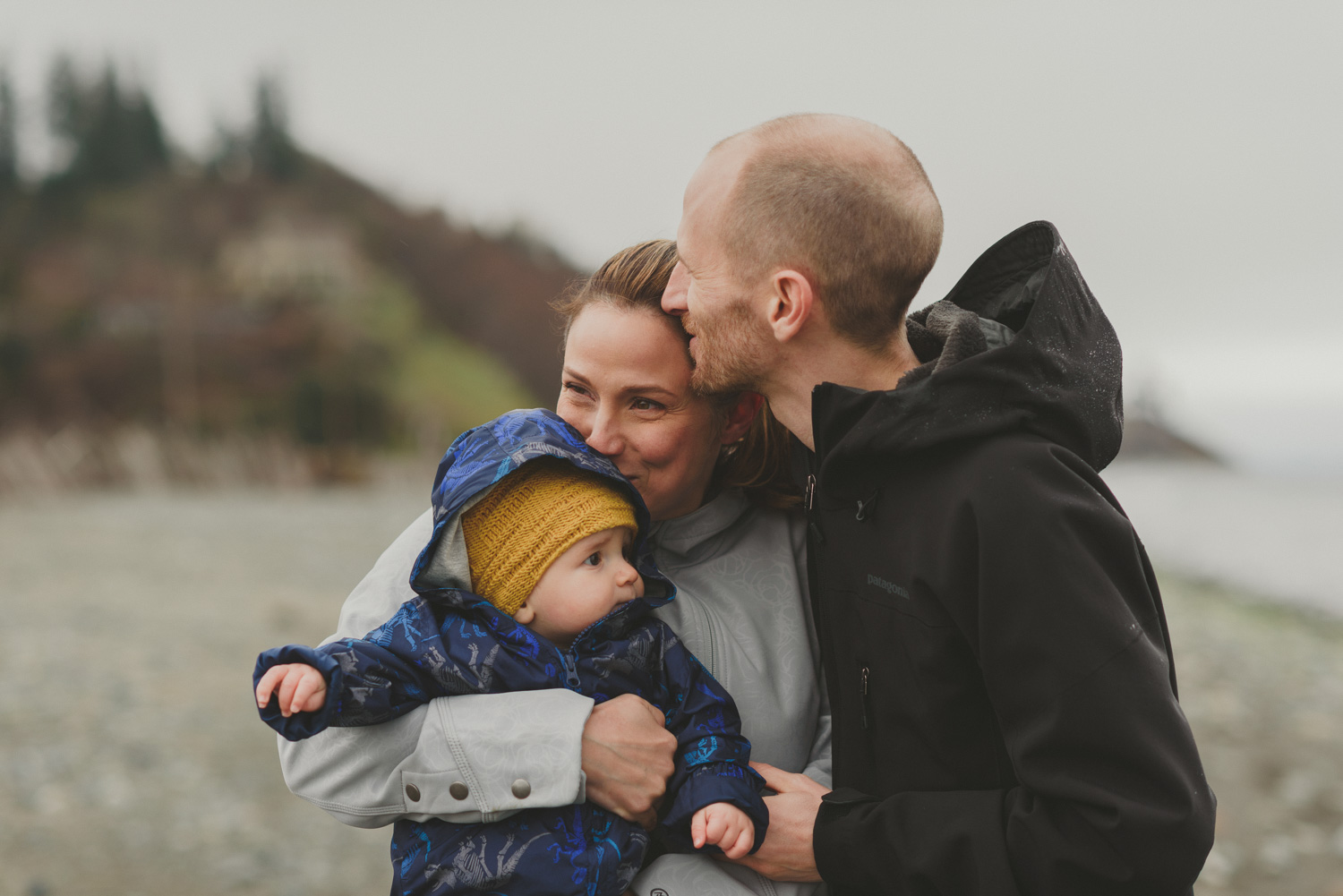 comox bc lifestyle family photography-family of 3 snuggling on the beach