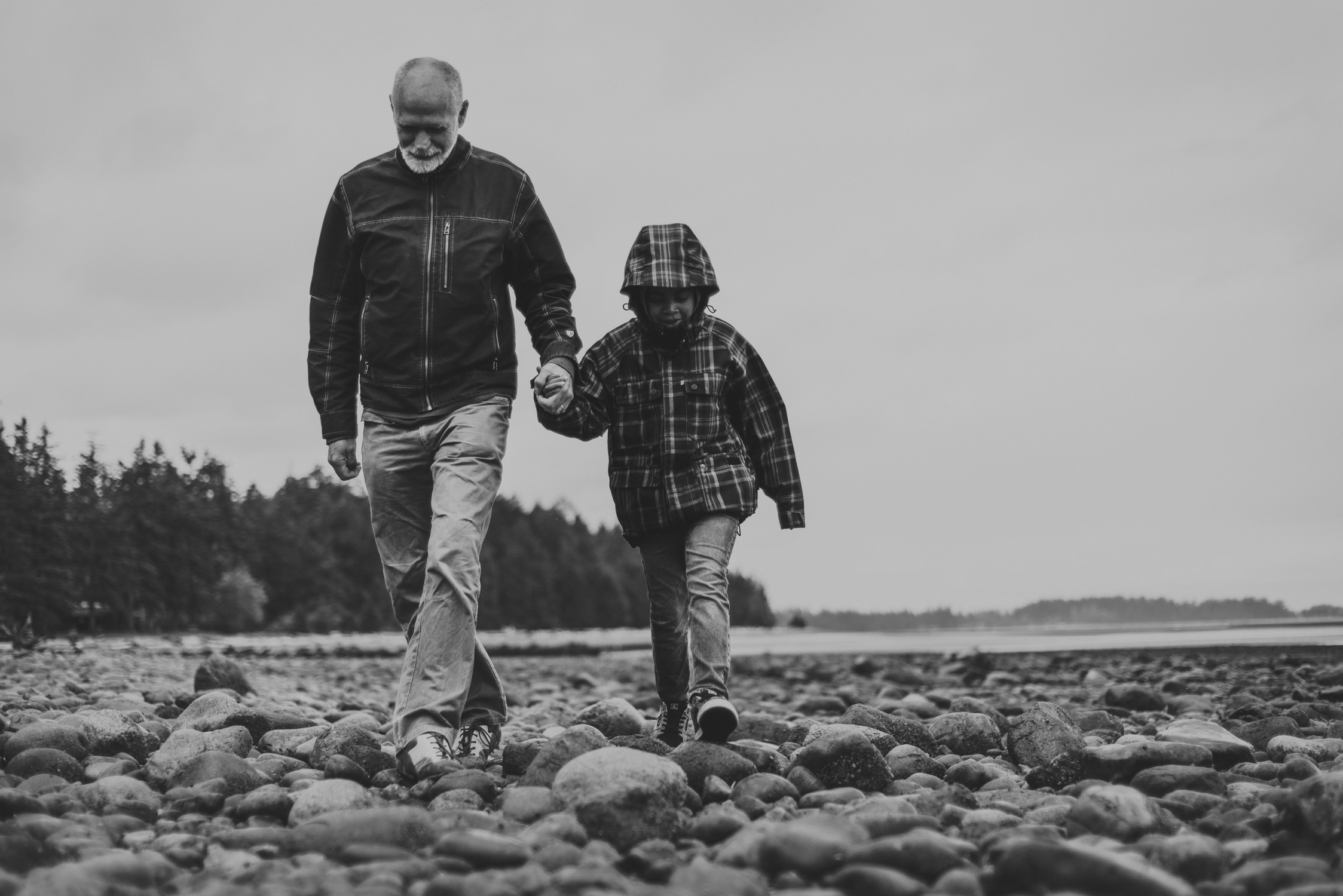 family travels - campbell river-father & daughter walking on the beach-multi-racial family