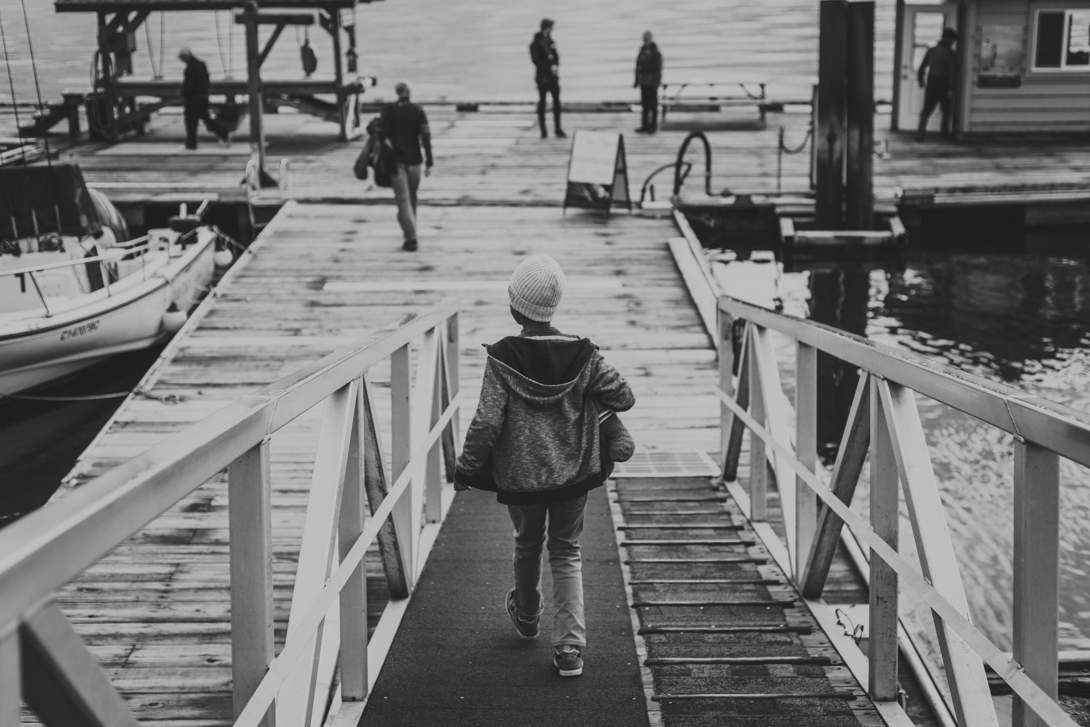 family travels - campbell river-kid walking down a dock