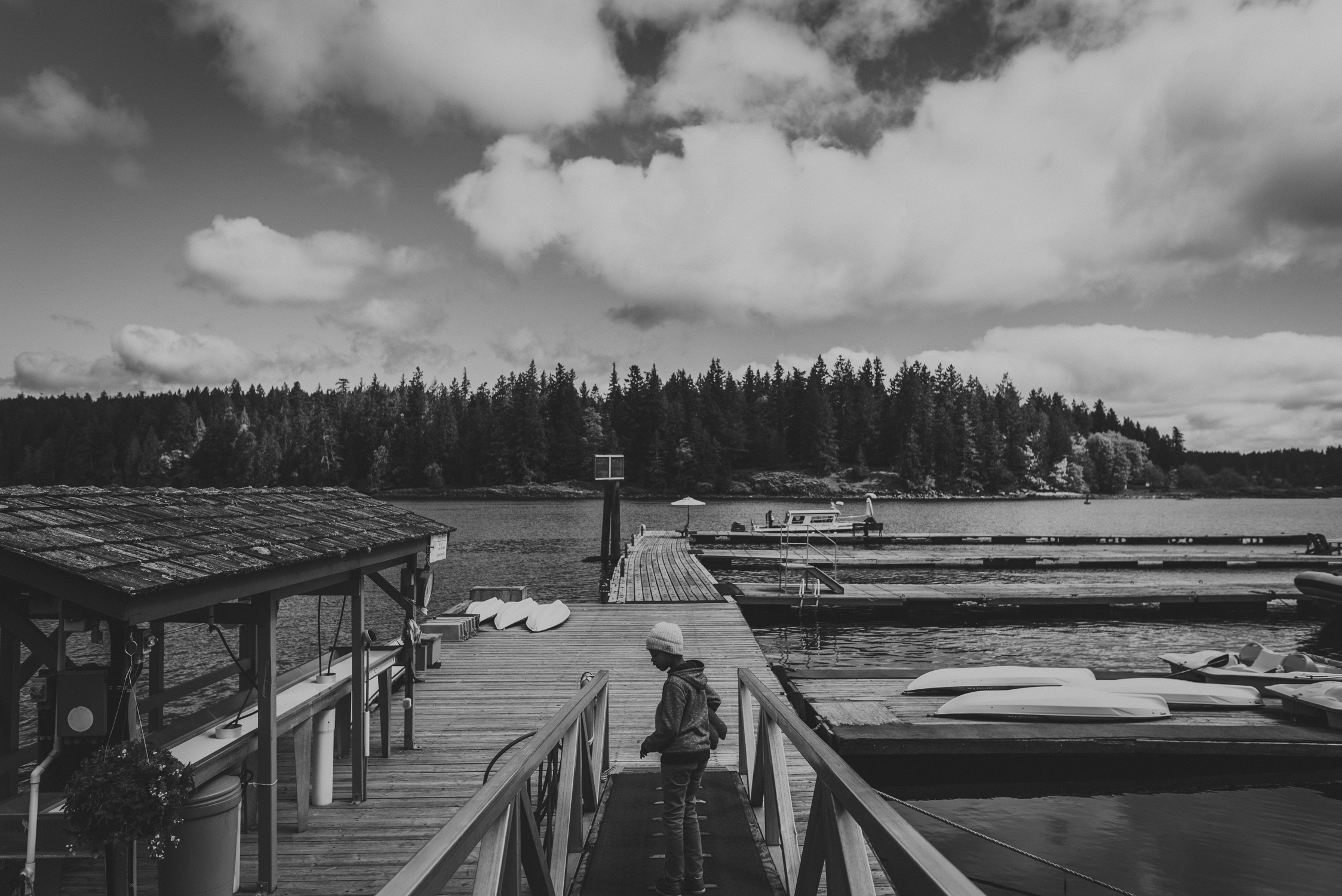 family travels - campbell river-kid walking down to a dock on quadra island