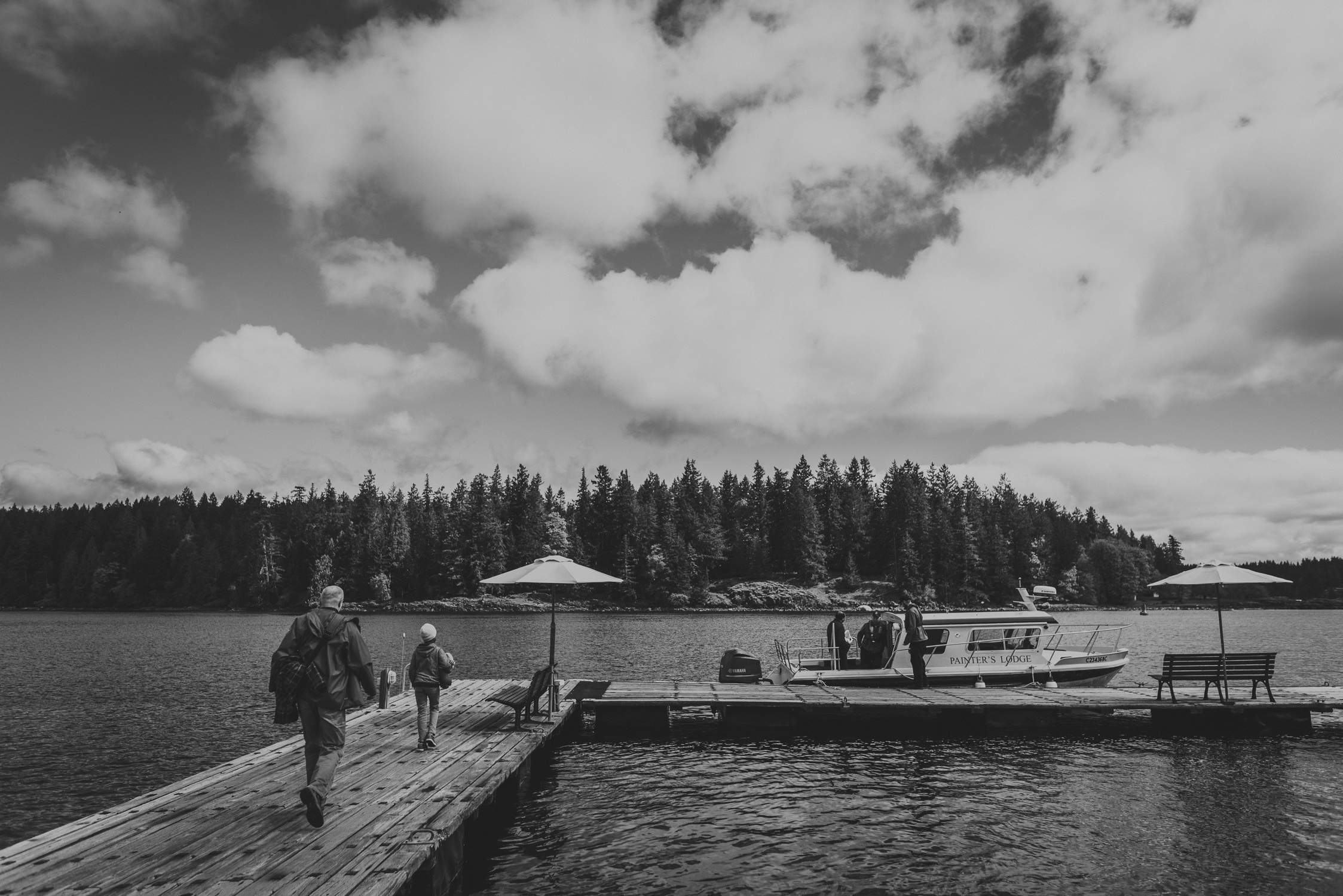 family travels - campbell river-father & kid walking on a dock 