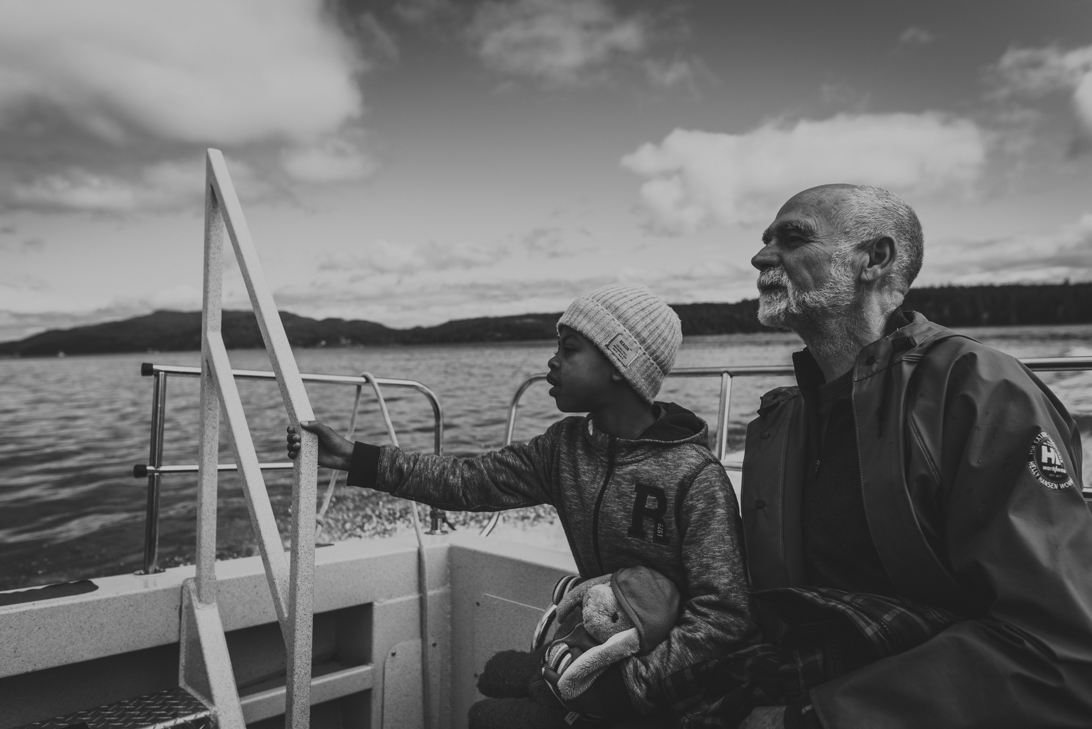 family travels - campbell river-father & daughter on the stern of a boat
