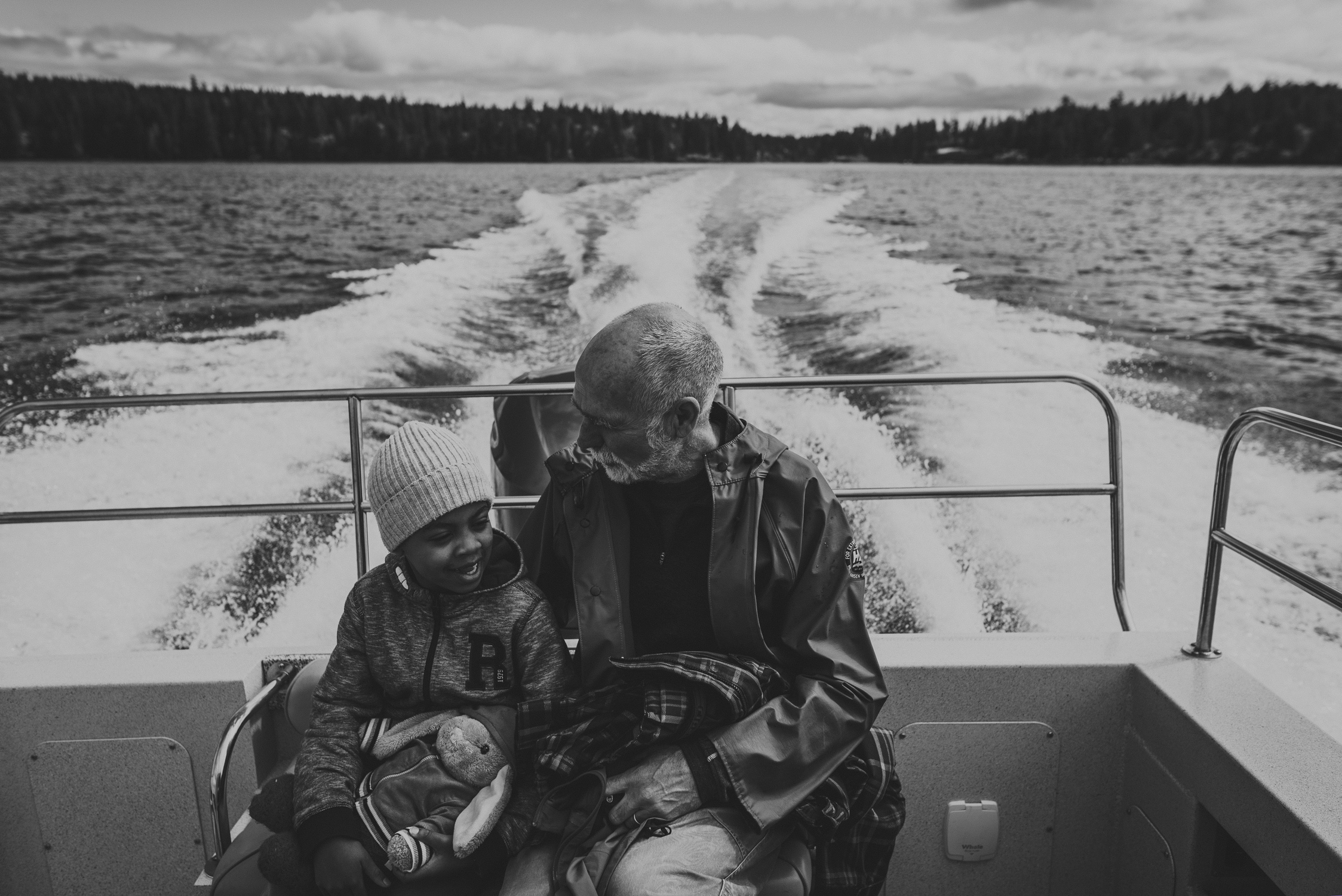 family travels - campbell river-father & daughter talking on the stern of a speed boat