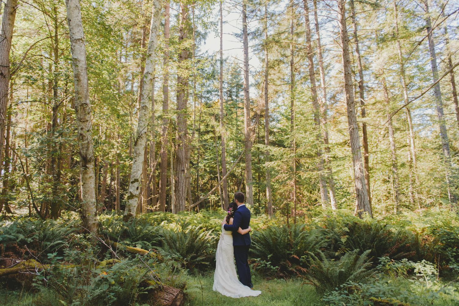 bride & groom under tall trees at bodega ridge galiano island