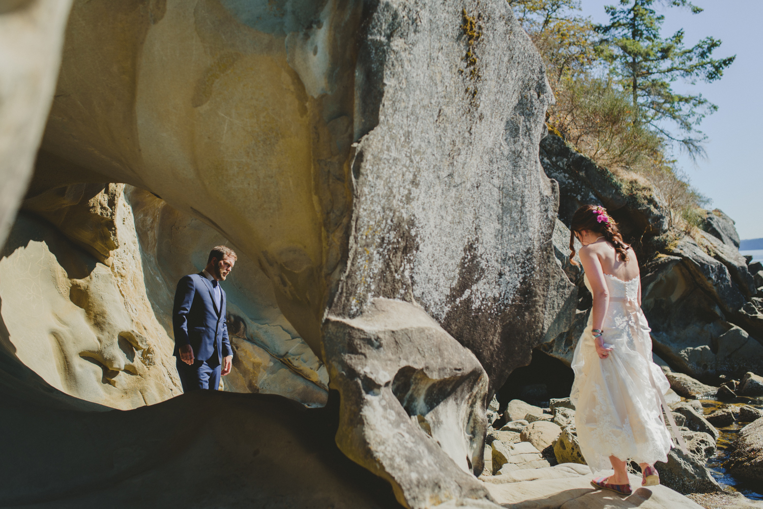 bride & groom by sandstone rocks at bodega ridge galiano island