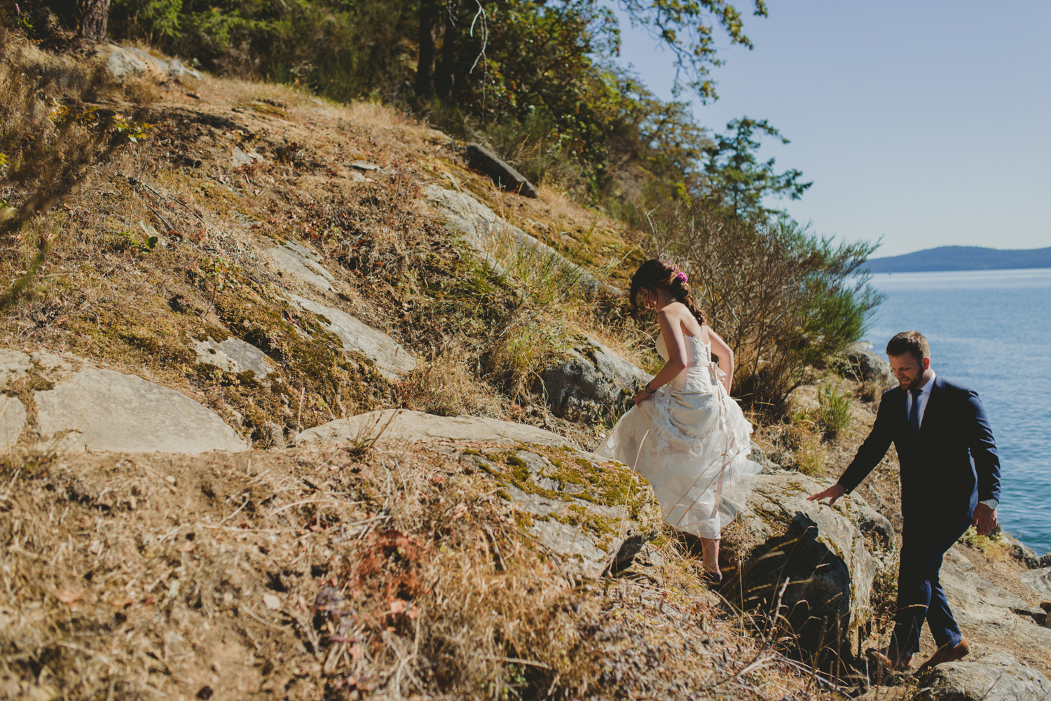 bride & groom by sandstone rocks at bodega ridge galiano island