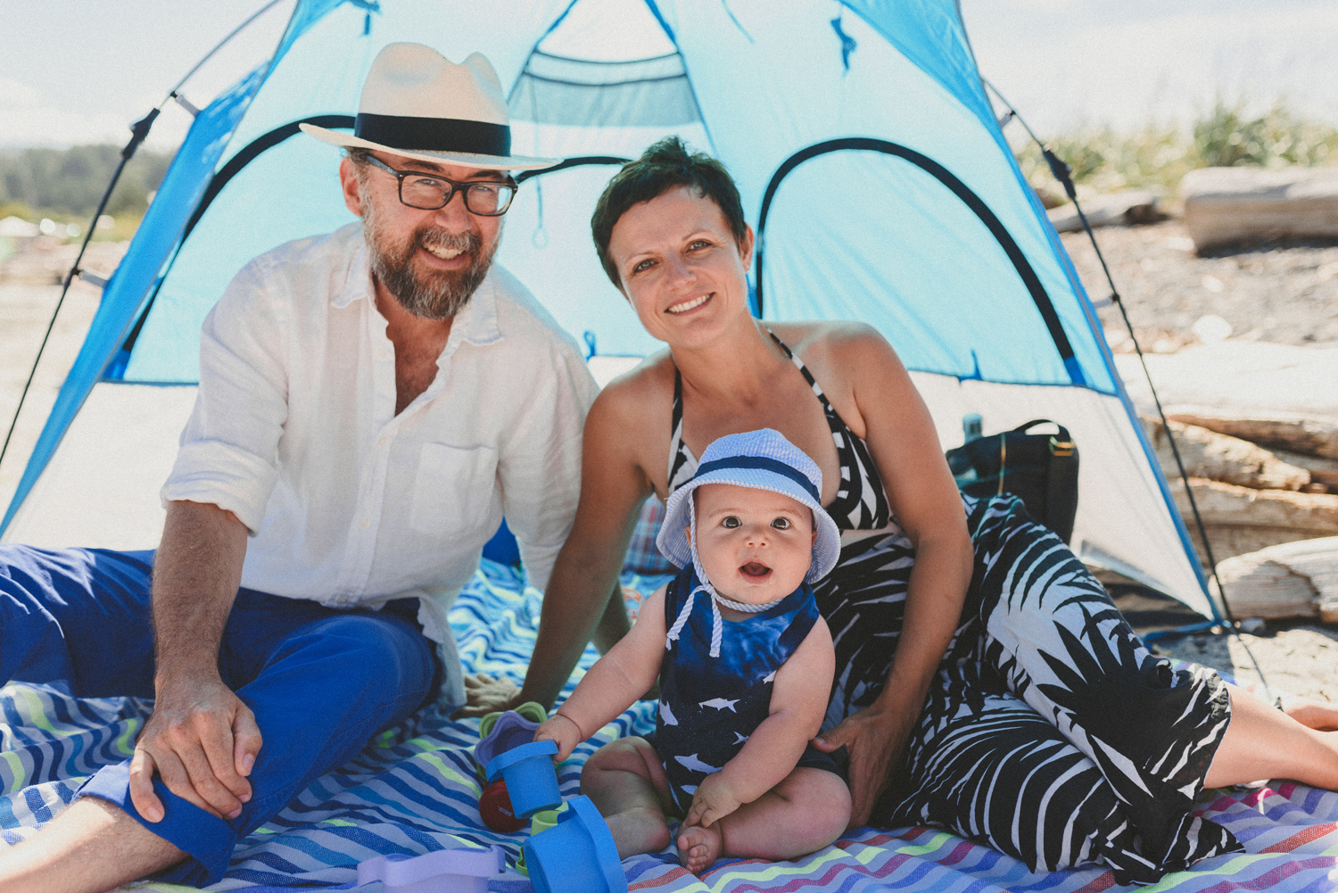 family under a beach tent on hornby island