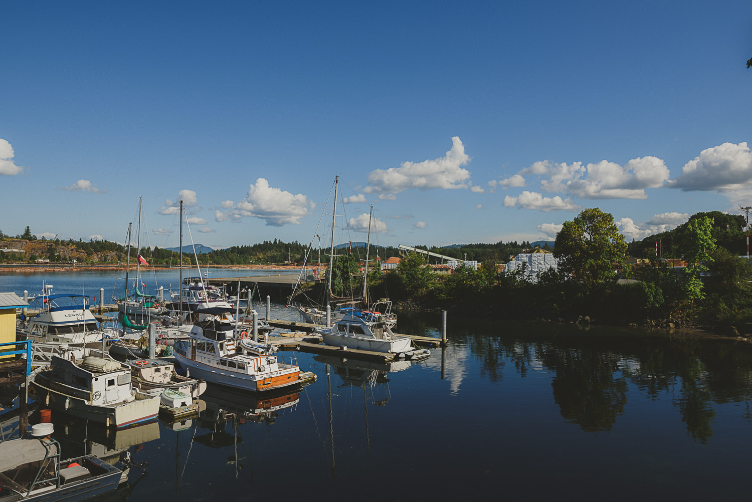 overbury resort thetis island wedding - boats in a sunlit harbour