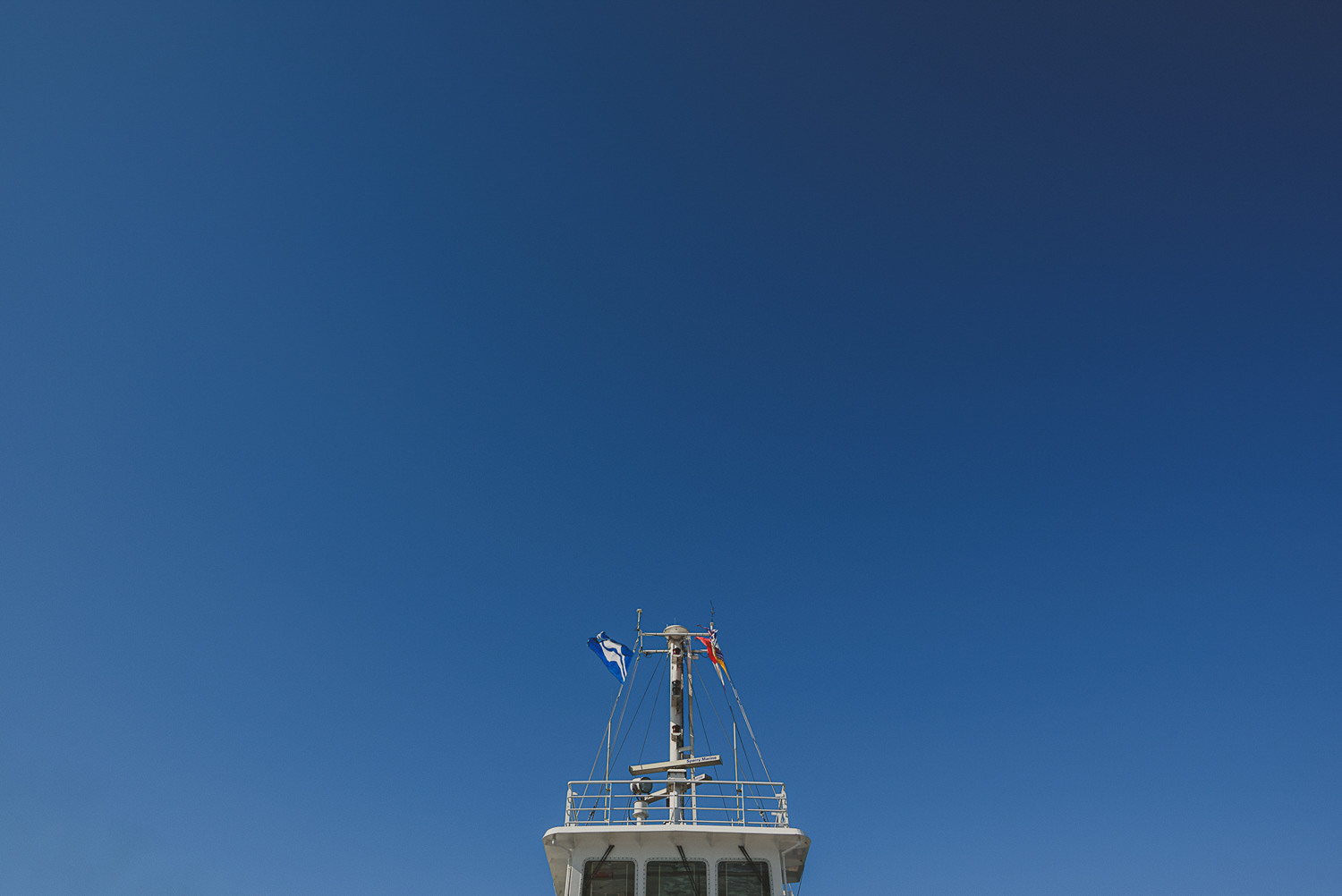 overbury resort thetis island wedding - ferry bridge against a blue sky