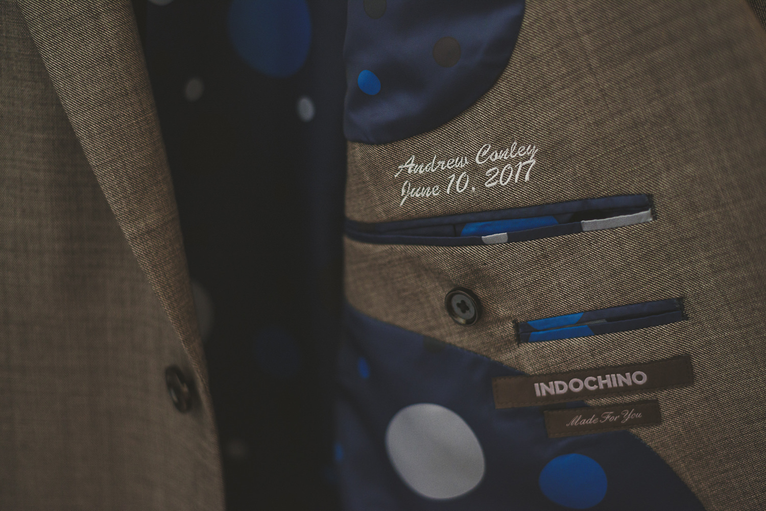 detail of groom’s suit at overbury resort thetis island wedding - 