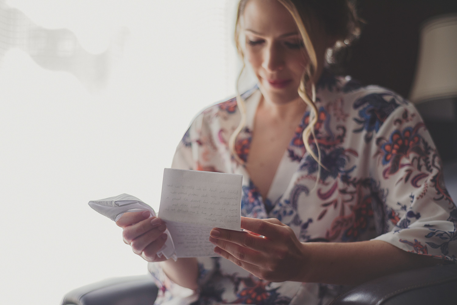 bride reading letter at overbury resort thetis island wedding 