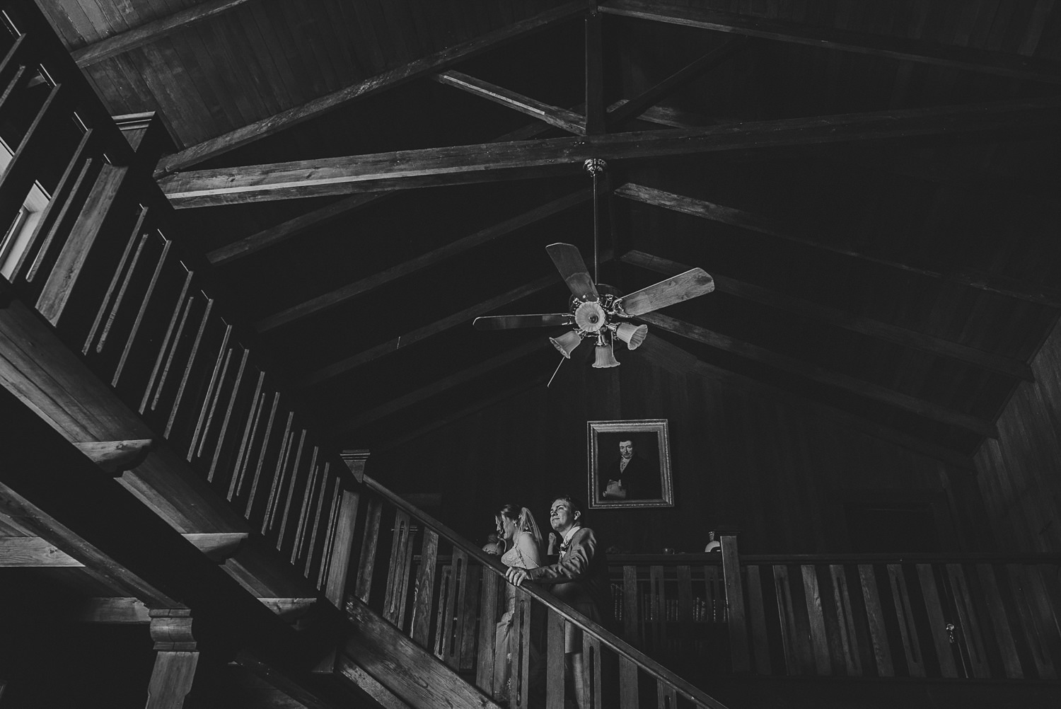 bride & groom walking up grand stair case at overbury resort thetis island wedding 