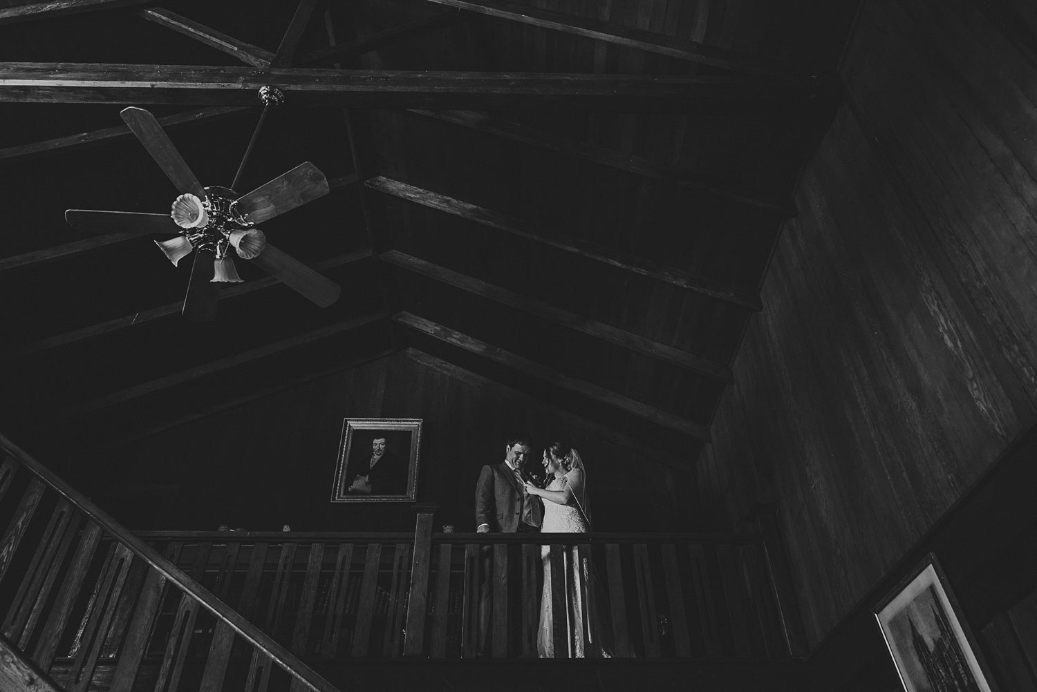 bride fixing groom’s boutineer at overbury resort thetis island wedding 