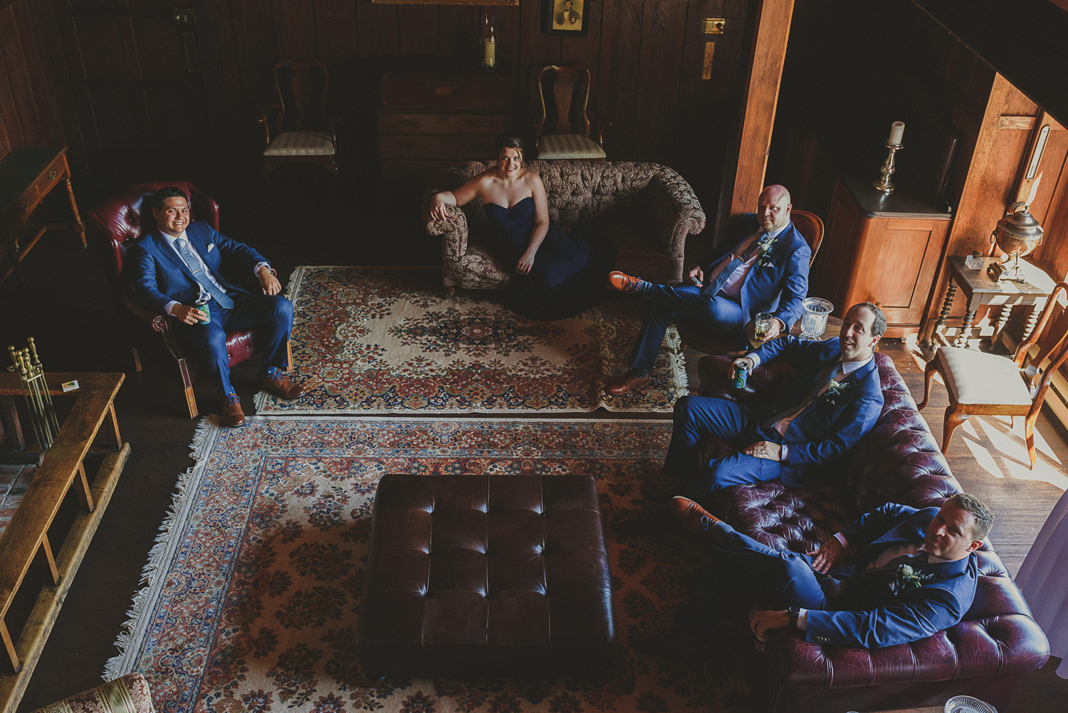 looking down on the wedding party in living room of overbury resort thetis island wedding 