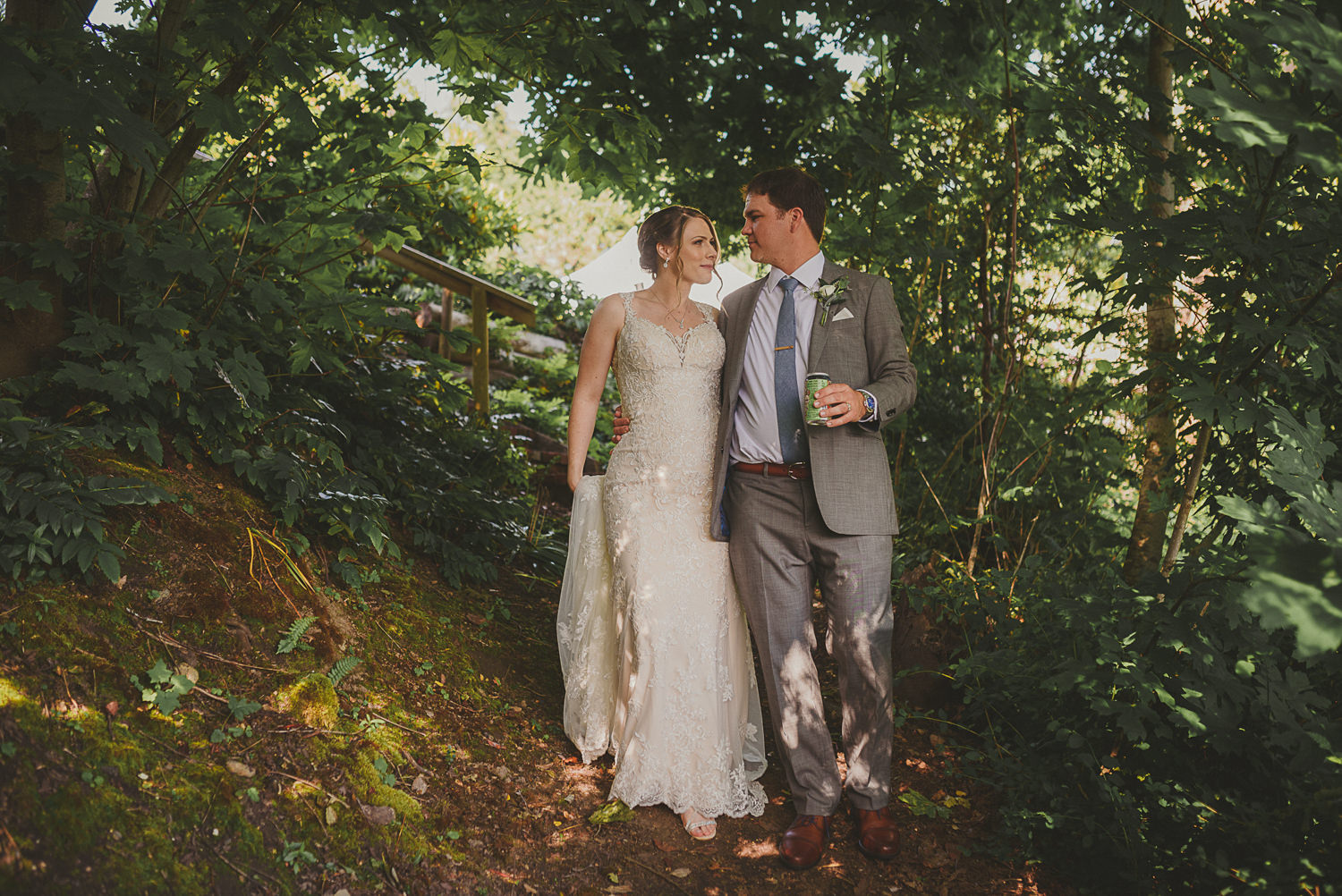 bride & groom walking amongst trees at overbury resort thetis island wedding 