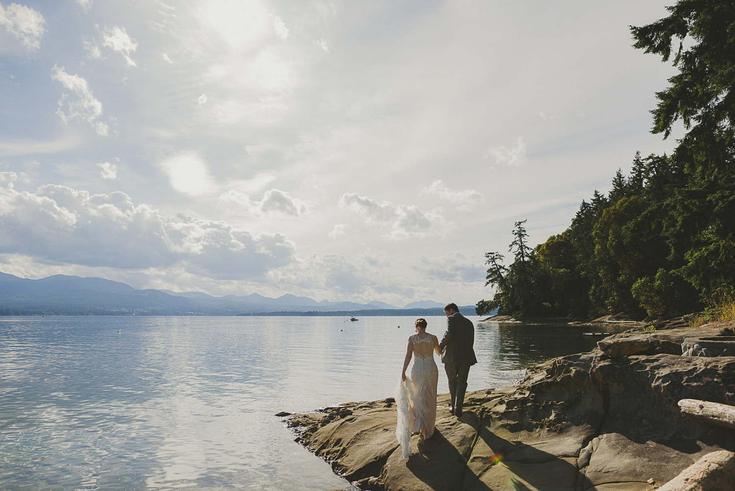 bride & groom walking on the sea shore at overbury resort thetis island wedding 