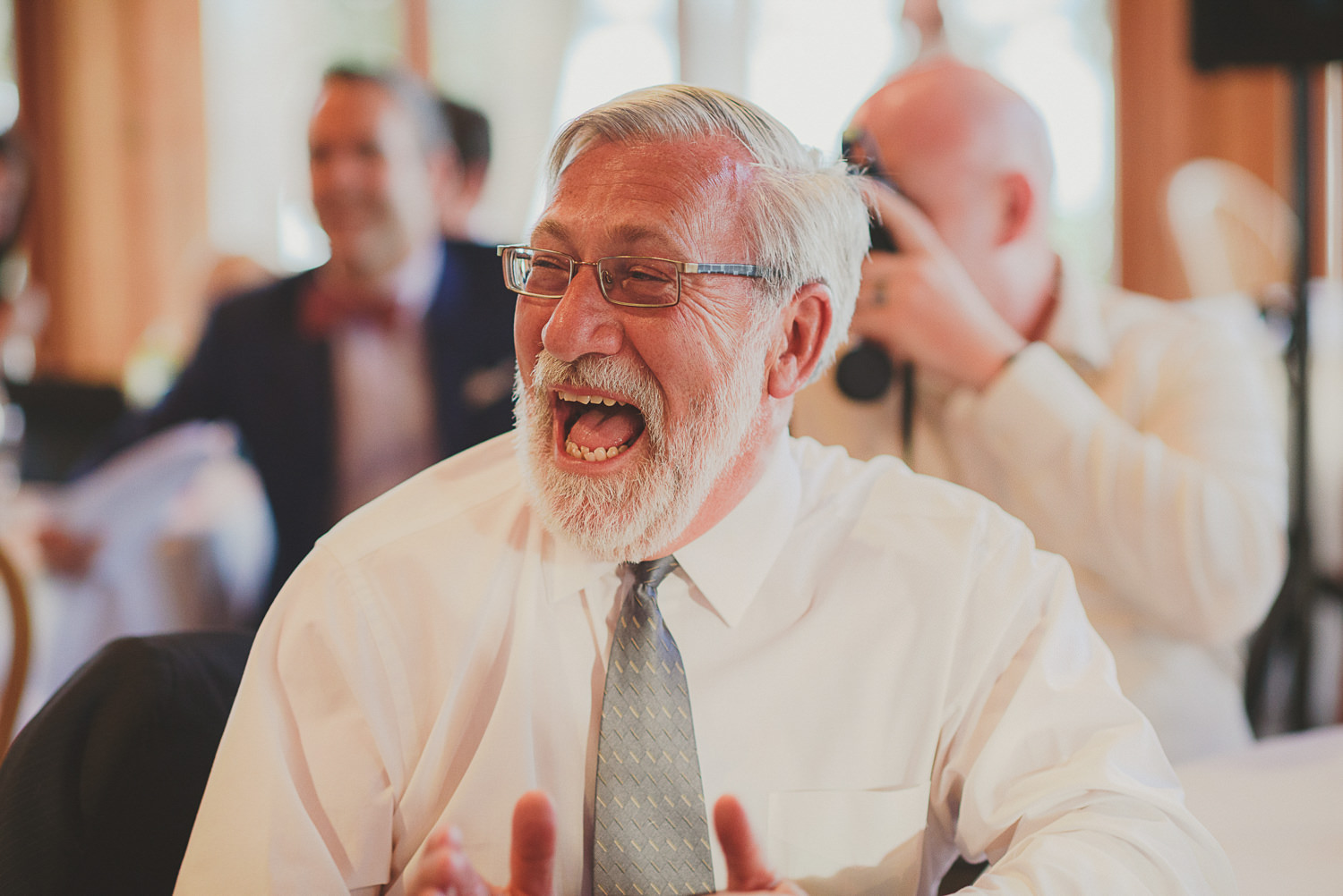 man laughing at overbury resort thetis island wedding 