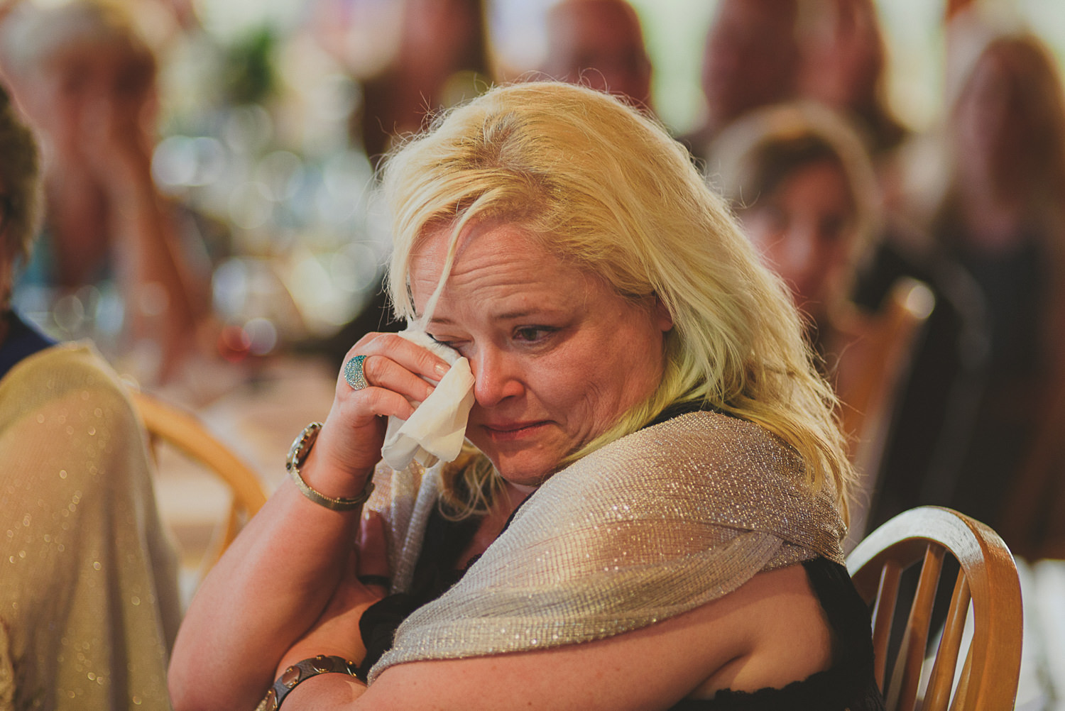 woman wiping tears at overbury resort thetis island wedding 