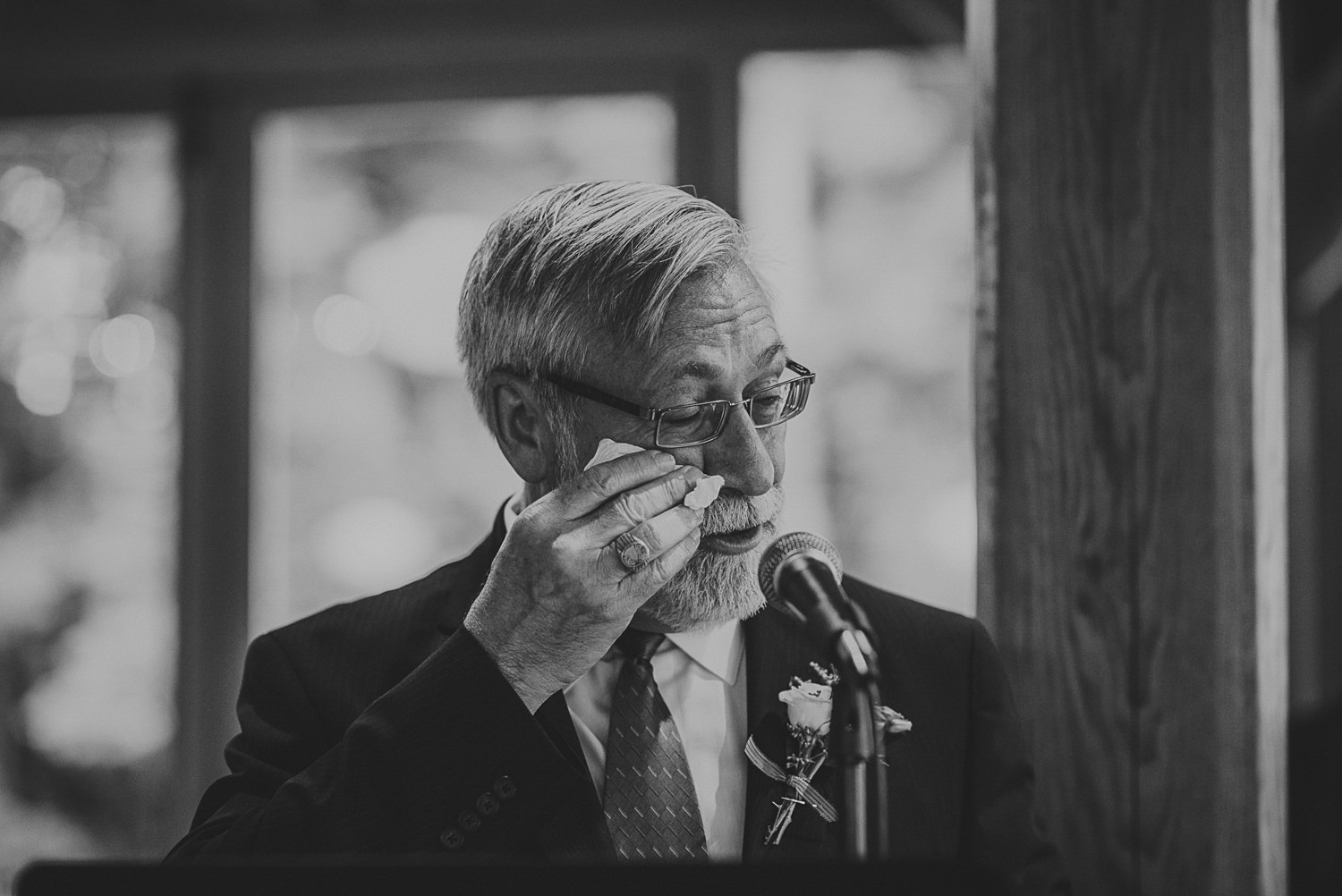 man wiping tears at overbury resort thetis island wedding 