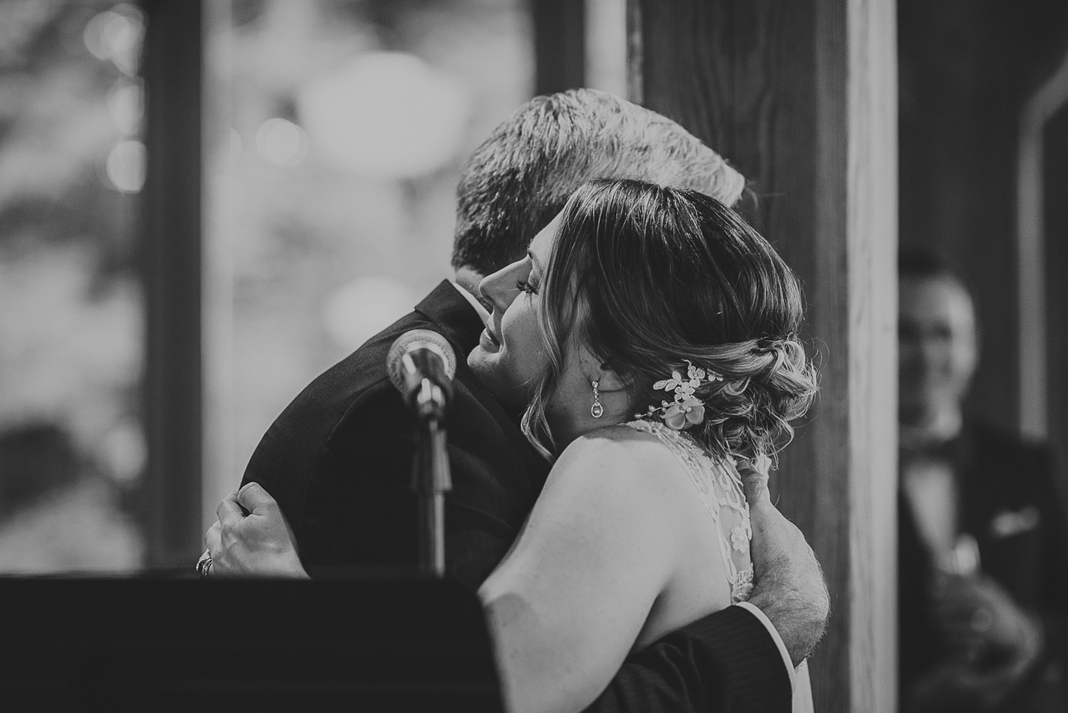 bride hugging father at overbury resort thetis island wedding 