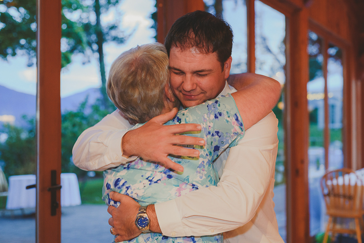 groom hugging mother at overbury resort thetis island wedding 