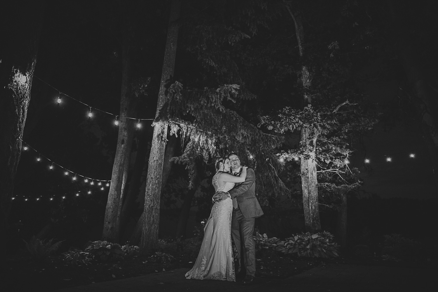 bride & groom dancing under twinkly lights at overbury resort thetis island wedding 
