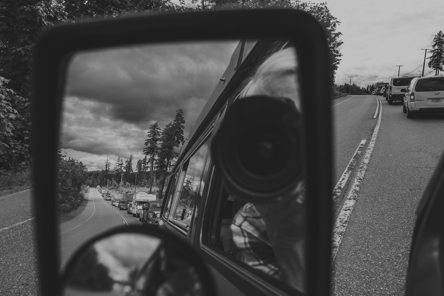 photo taken in rear view mirror of island highway traffic jam