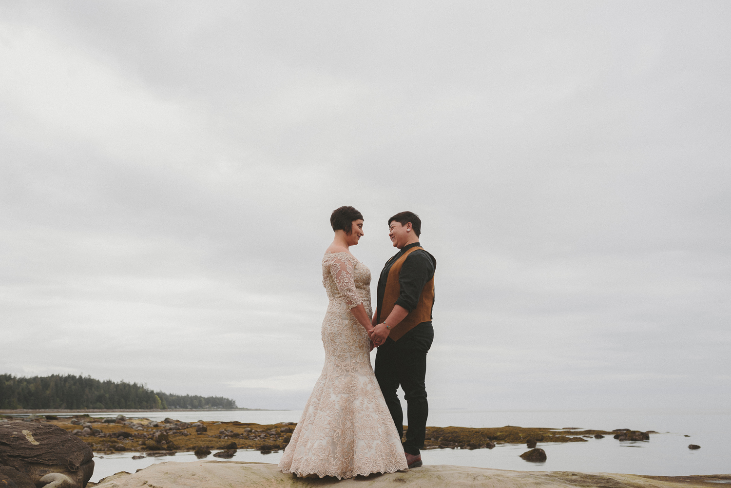 lgbtq jewish pagan metis wedding at sea breeze lodge on hornby island couple on beach