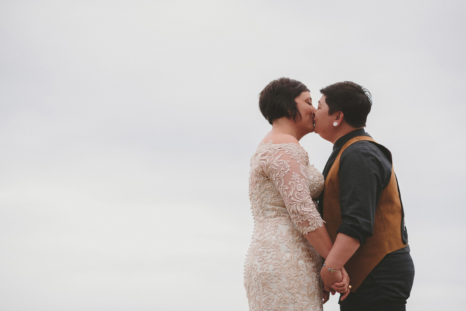 lgbtq jewish pagan metis wedding at sea breeze lodge on hornby island couple kissing