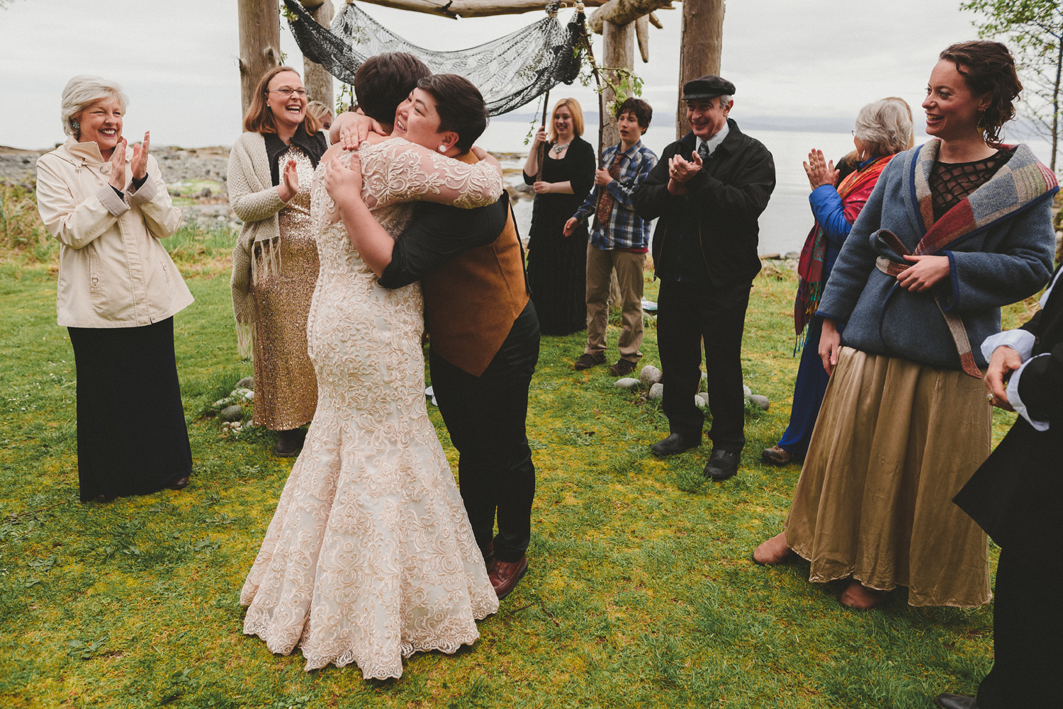 lgbtq jewish pagan metis wedding at sea breeze lodge on hornby island couple hugging