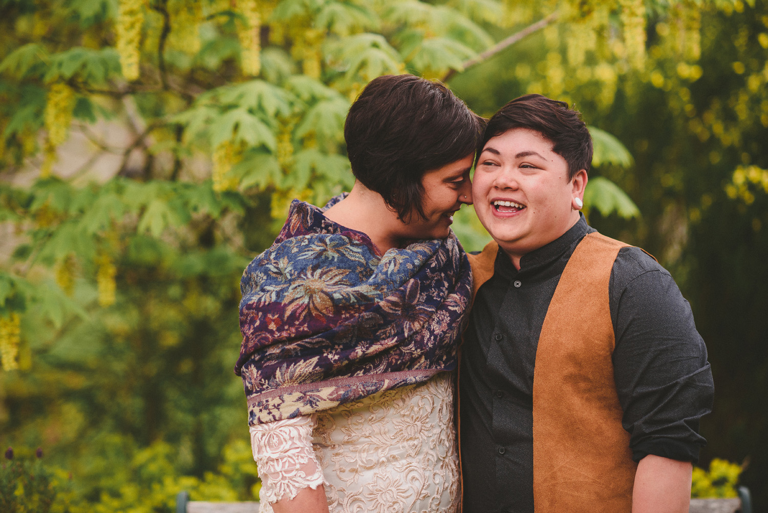lgbtq jewish pagan metis wedding at sea breeze lodge on hornby island couple smiling together