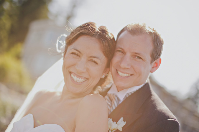 close up of smiling bride and groom