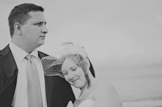 groom and bride with birdcage veil