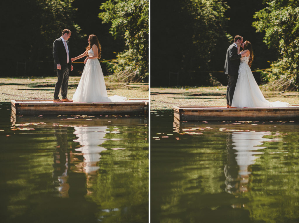groom seeing his bride for the first time on a dock surrounded by forest