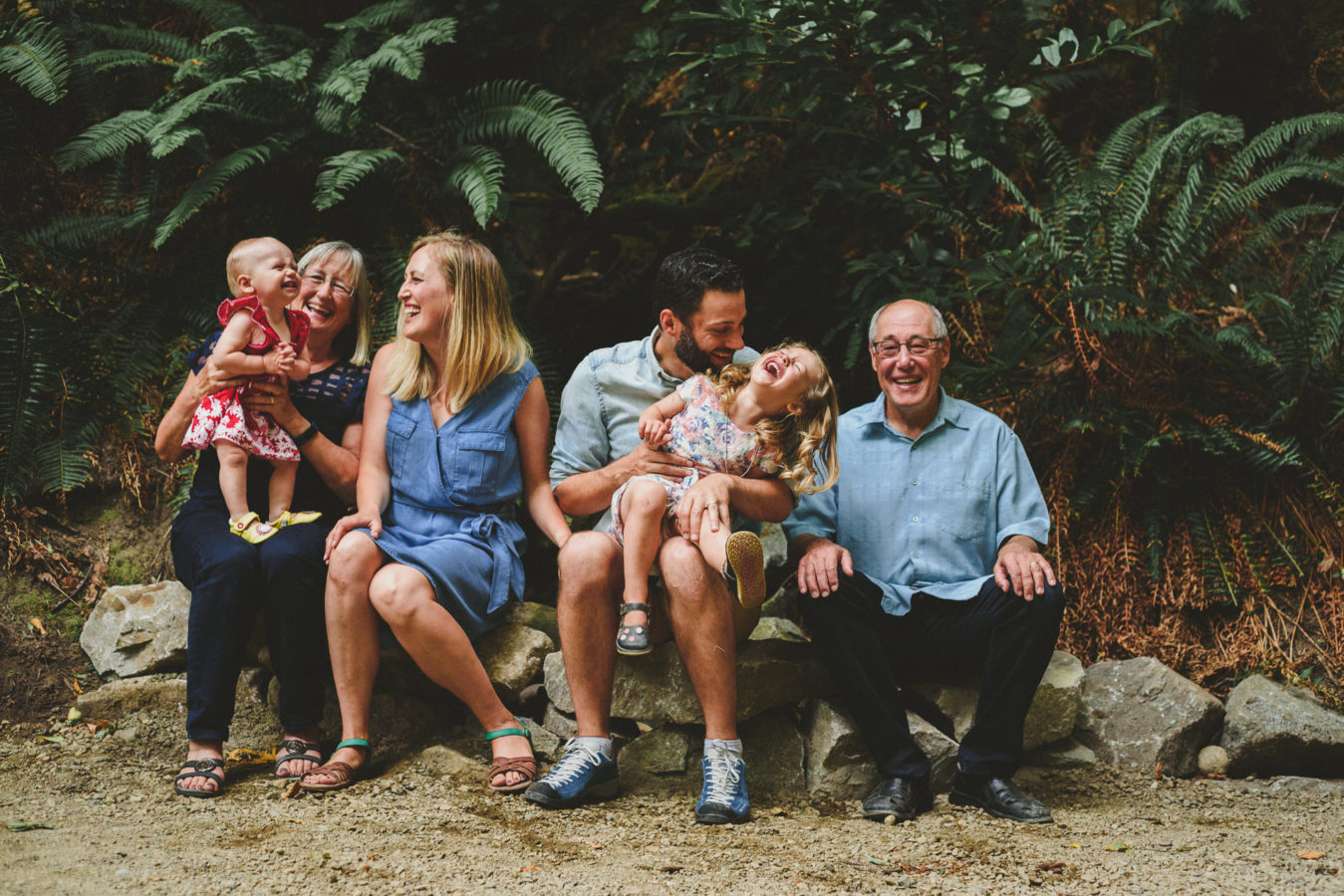 group family photo where everyone is looking somewhere different & many are laughing