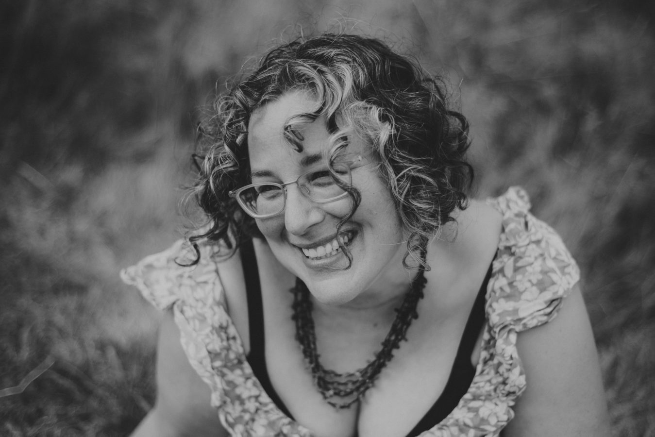 looking down on a woman laughing and smiling