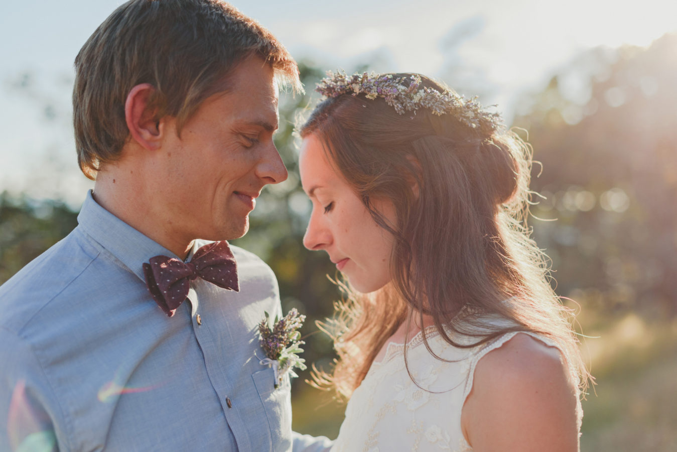 intimate moment of a bride and groom with their heads close together on their wedding day